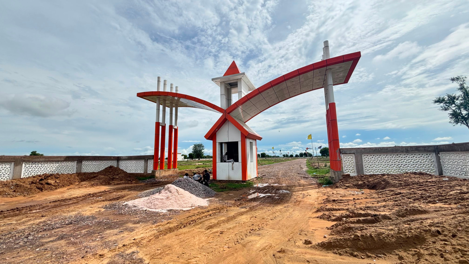 Side view of the Lalita Kunj entrance gate and boundary wall